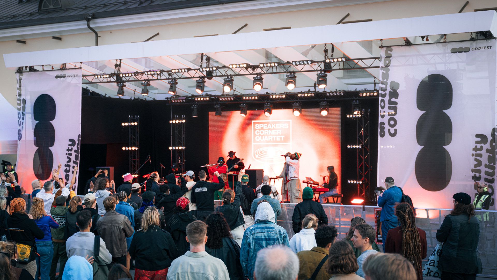 A festival crowd in front of a lit stage at ODDfest